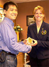 Hong Kong Sports Association of the Deaf president exchanges gift with Tiffany Granfors